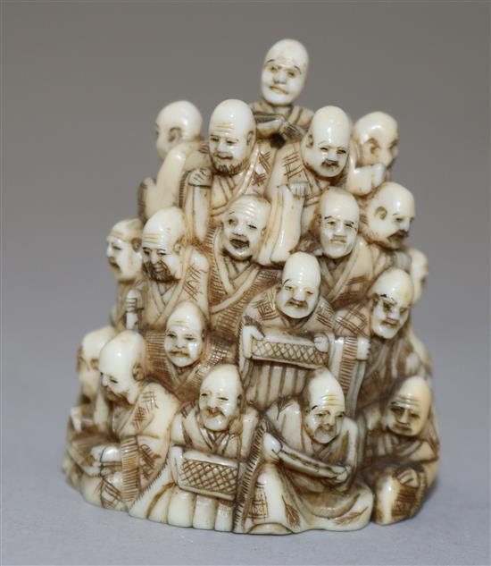 A Japanese ivory netsuke of multiple rakan, Meiji period, height 5.6cm